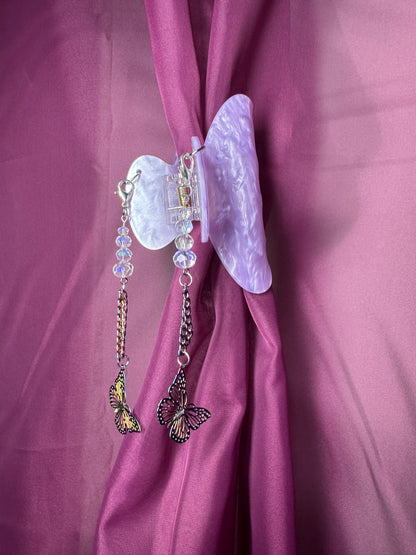 Purple hair claw with butterfly charms